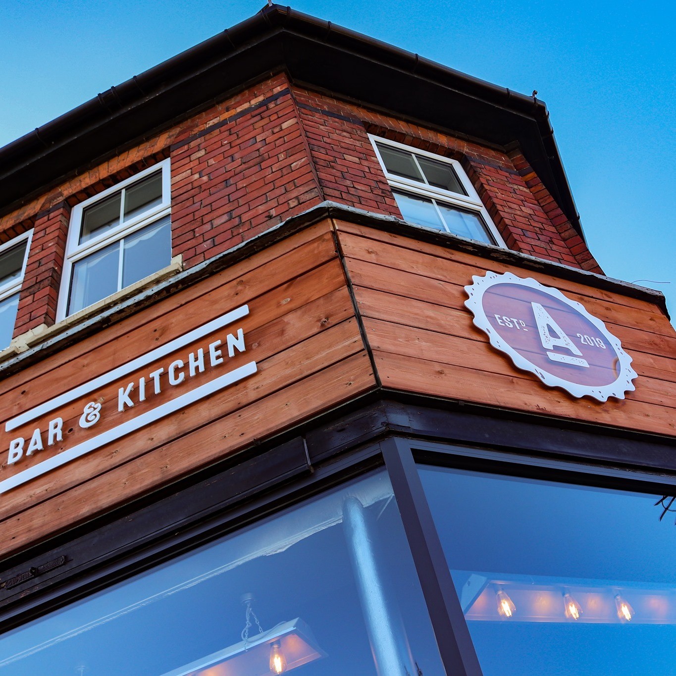 two cell phones on a gray surface