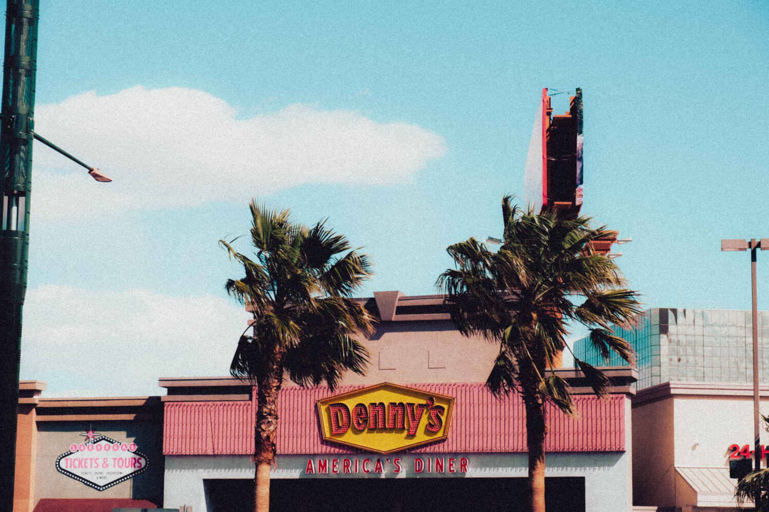 Colorful image of a fast food restaurant against a blue sky