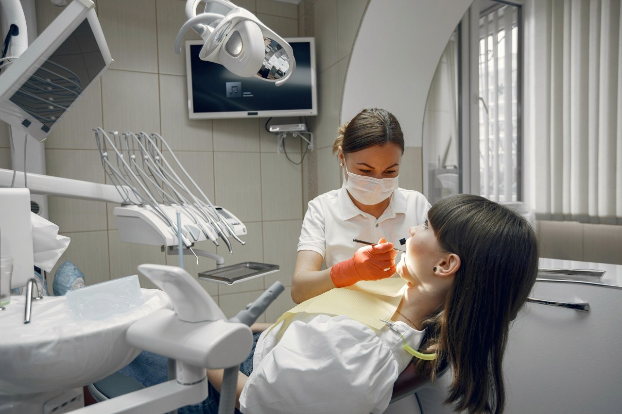 A dentist treating a patient