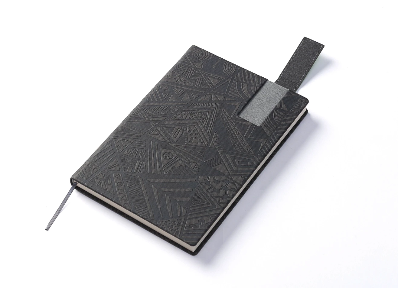 Angled view showing the green magnetic strap lifted to reveal the closure mechanism.