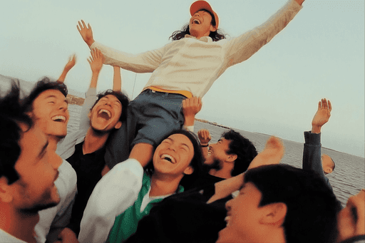 Trendy looking person using laptop from behind during day in cozy, modern home office