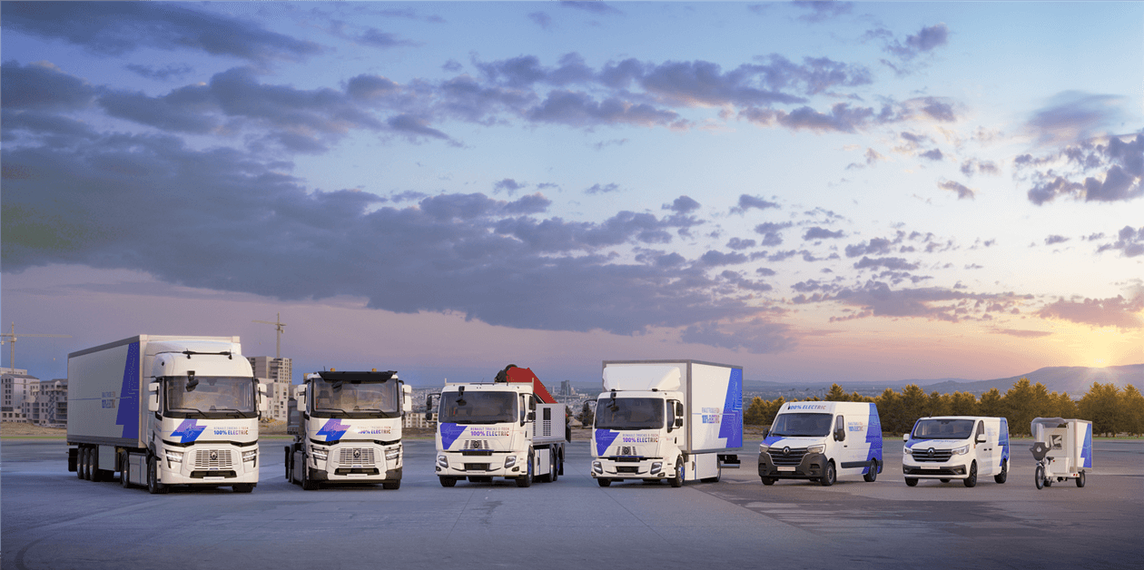 Electric trucks charging at a modern station, reflecting France’s €2 billion investment in green freight transport.