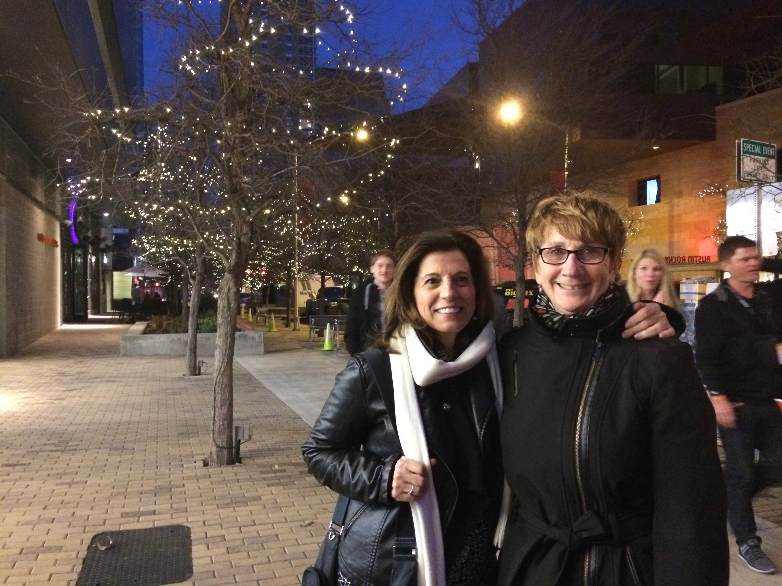 portrait of two women on the sidewalk
