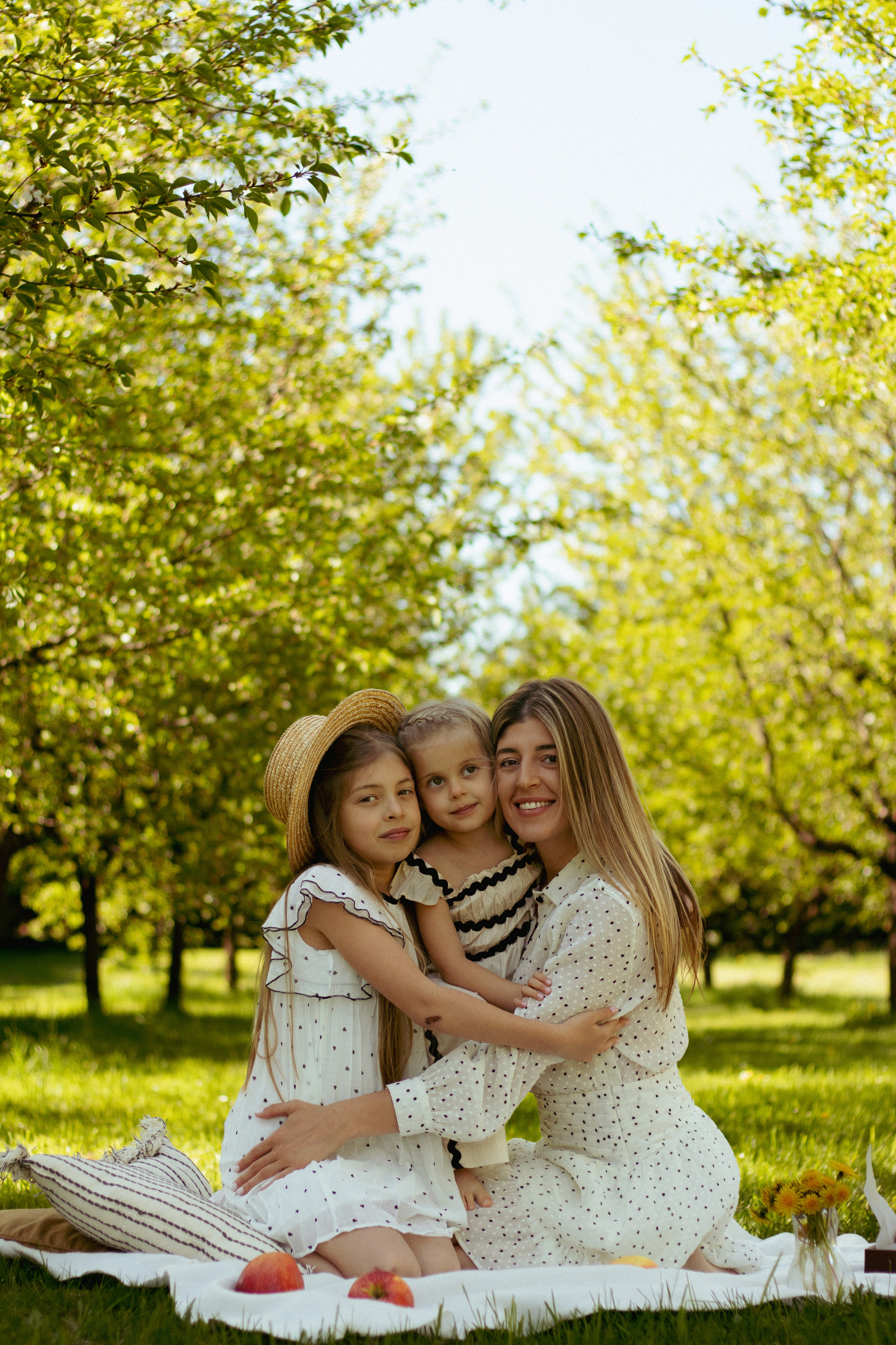 family photo on green grass during golden hour