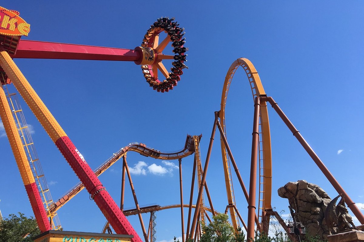 three brown wooden boat on blue lake water taken at daytime