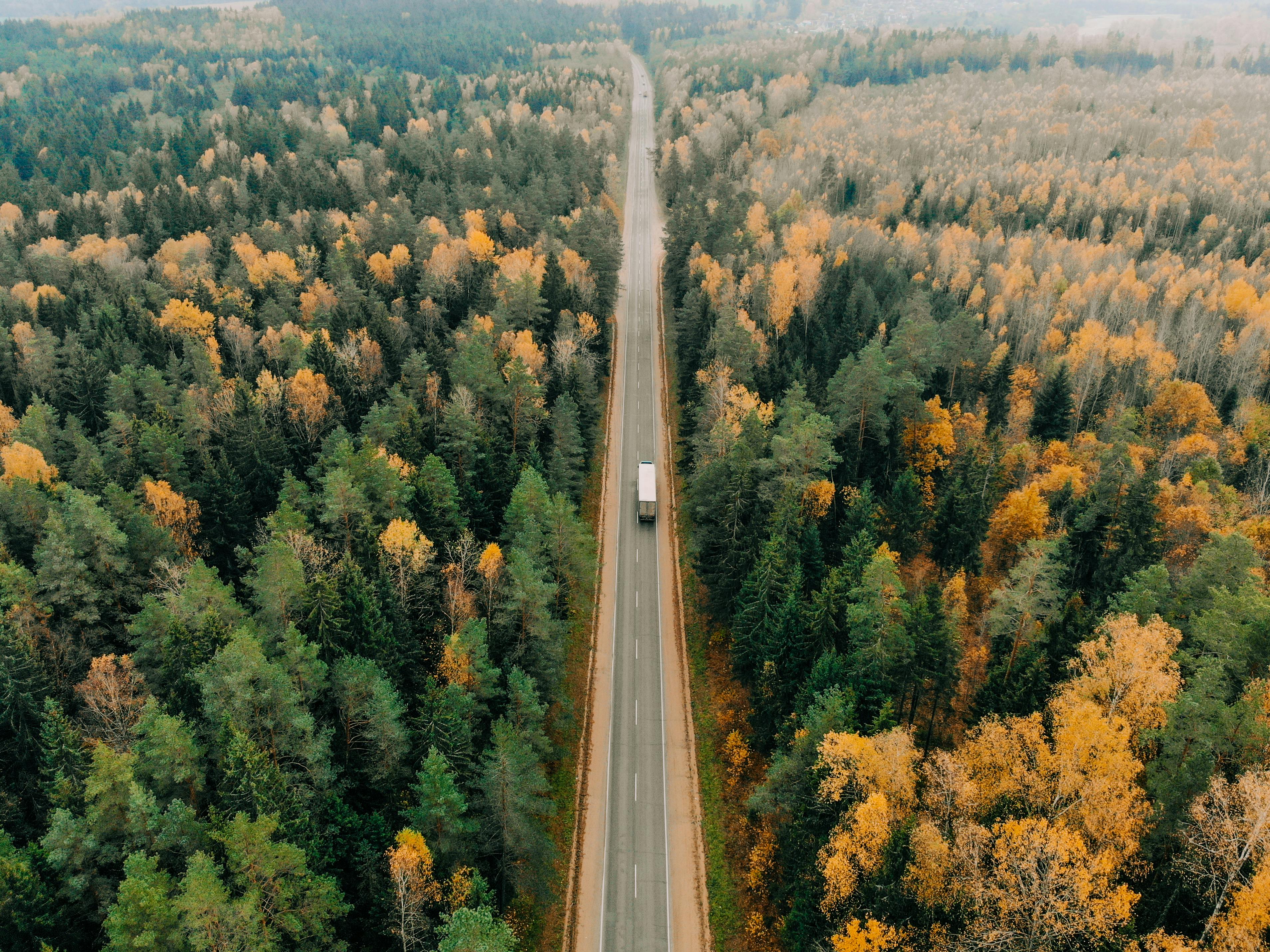 Truck driving on an open road with no other commuters