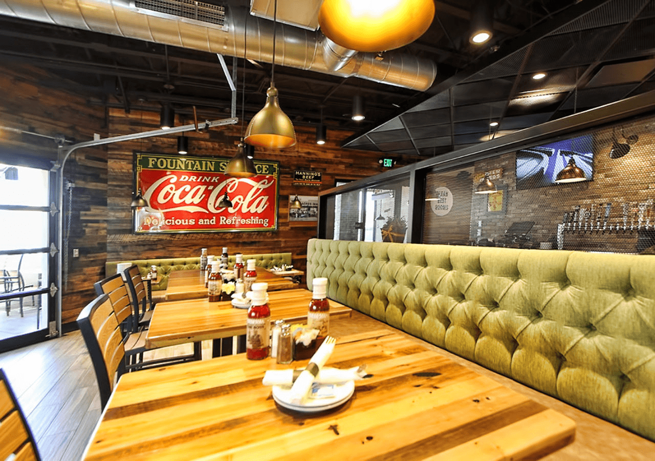 Close-up of a table and bench in the restaurant, emphasizing the stylish and functional interiors.