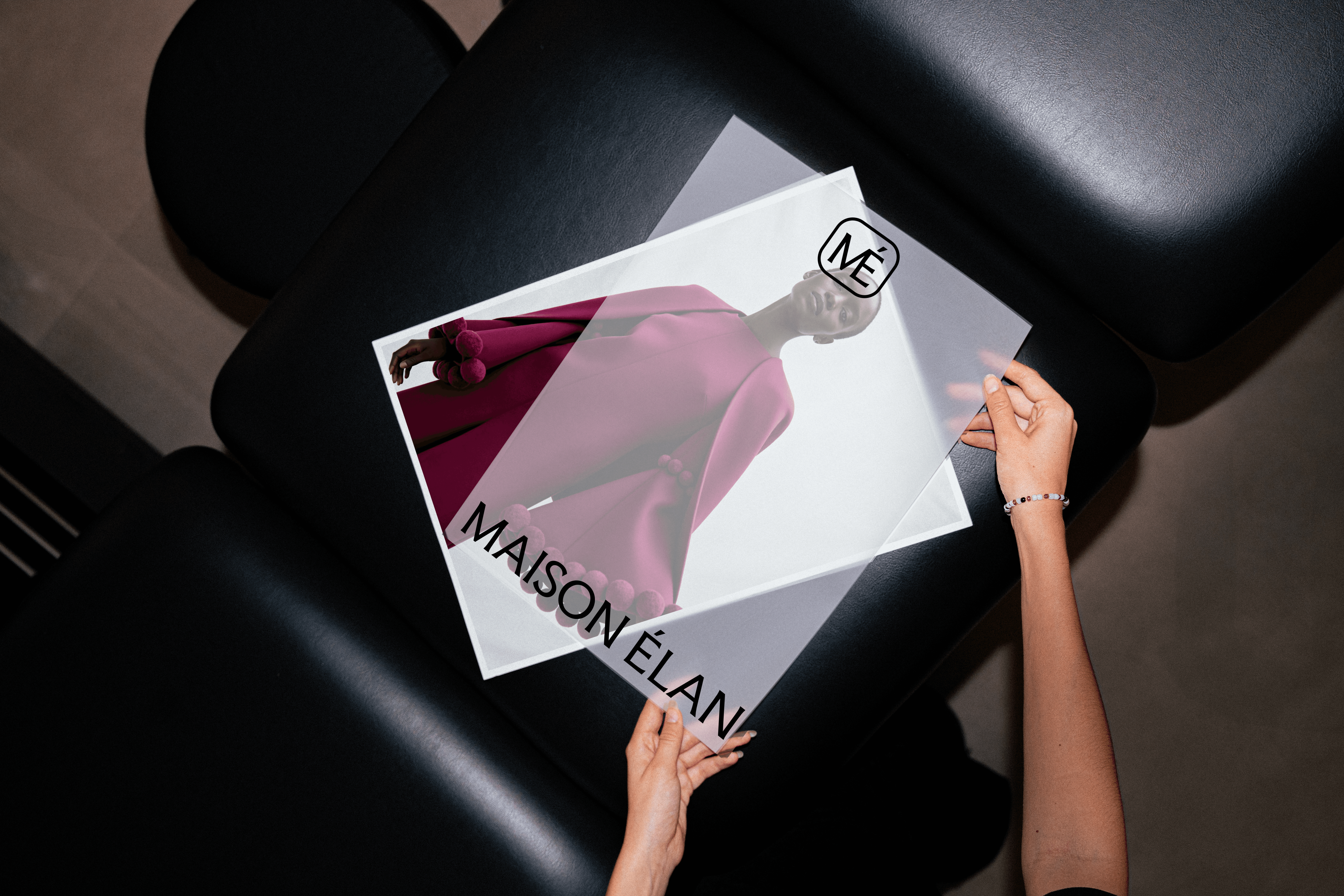 A poster design for the fashion brand Maison Élan, featuring a woman wearing a burgandy outfit.