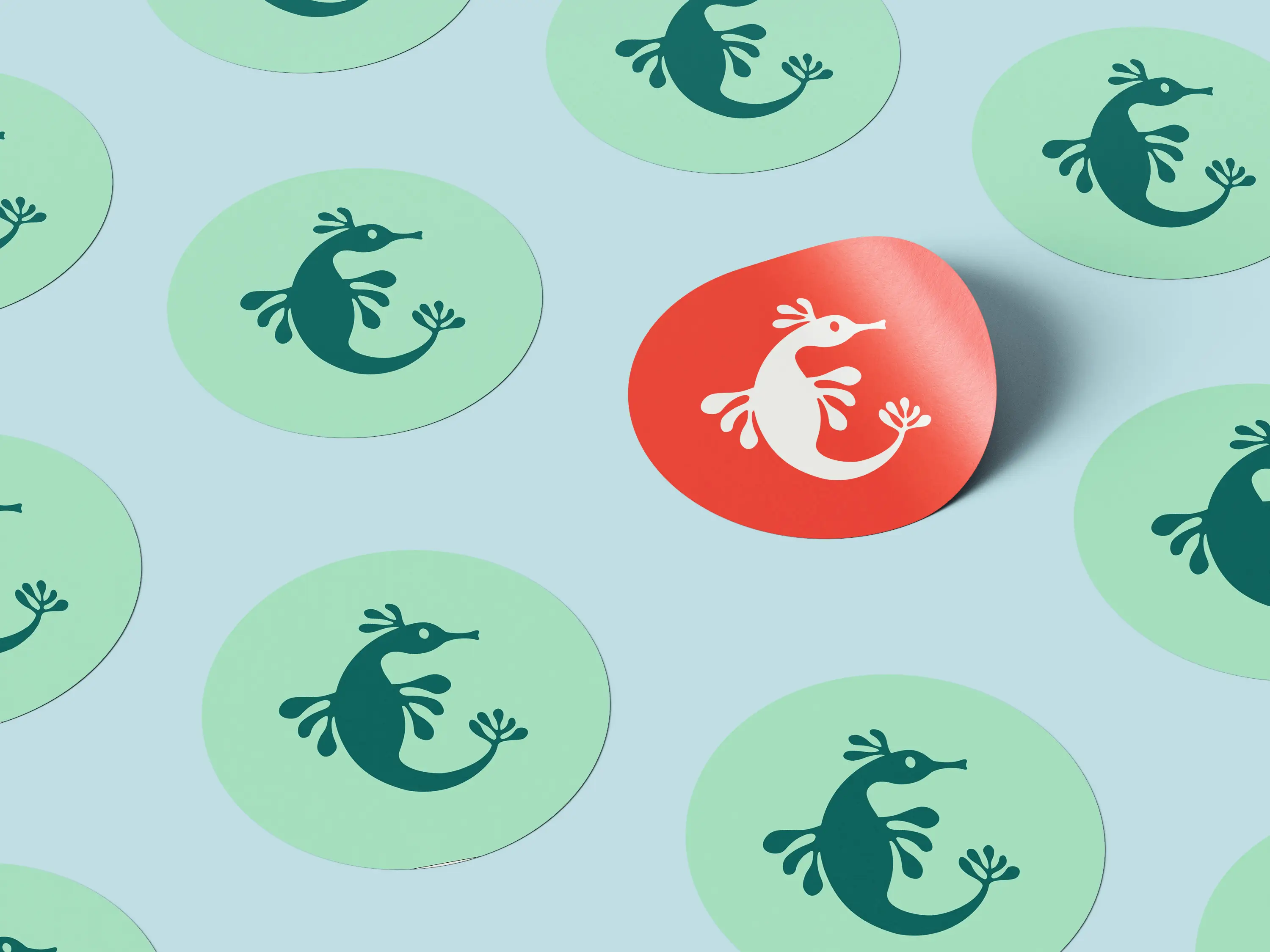 A light blue background with multiple green circular icons featuring a stylized letter "e," and one red icon.