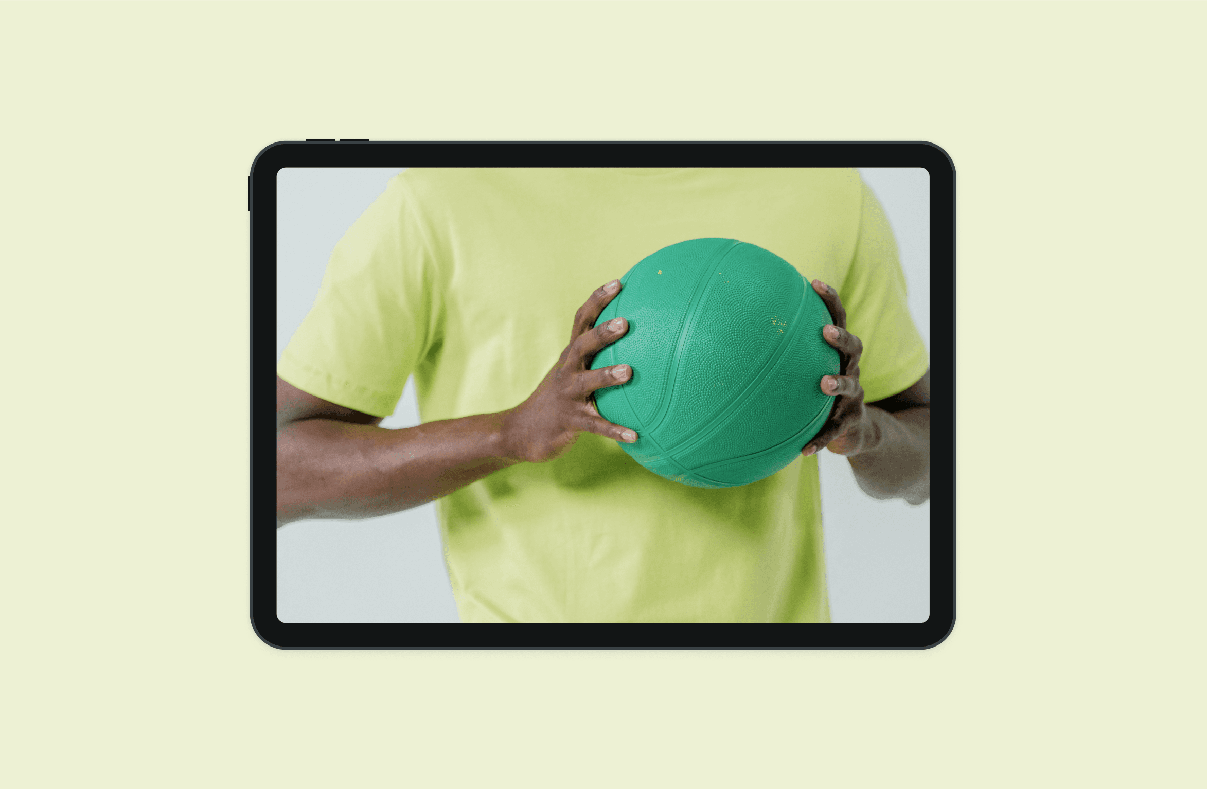 A mockup of a phone displaying an image of a man holding a basketball