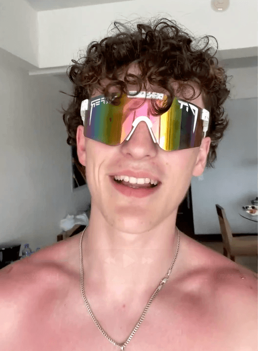 man standing beside wall