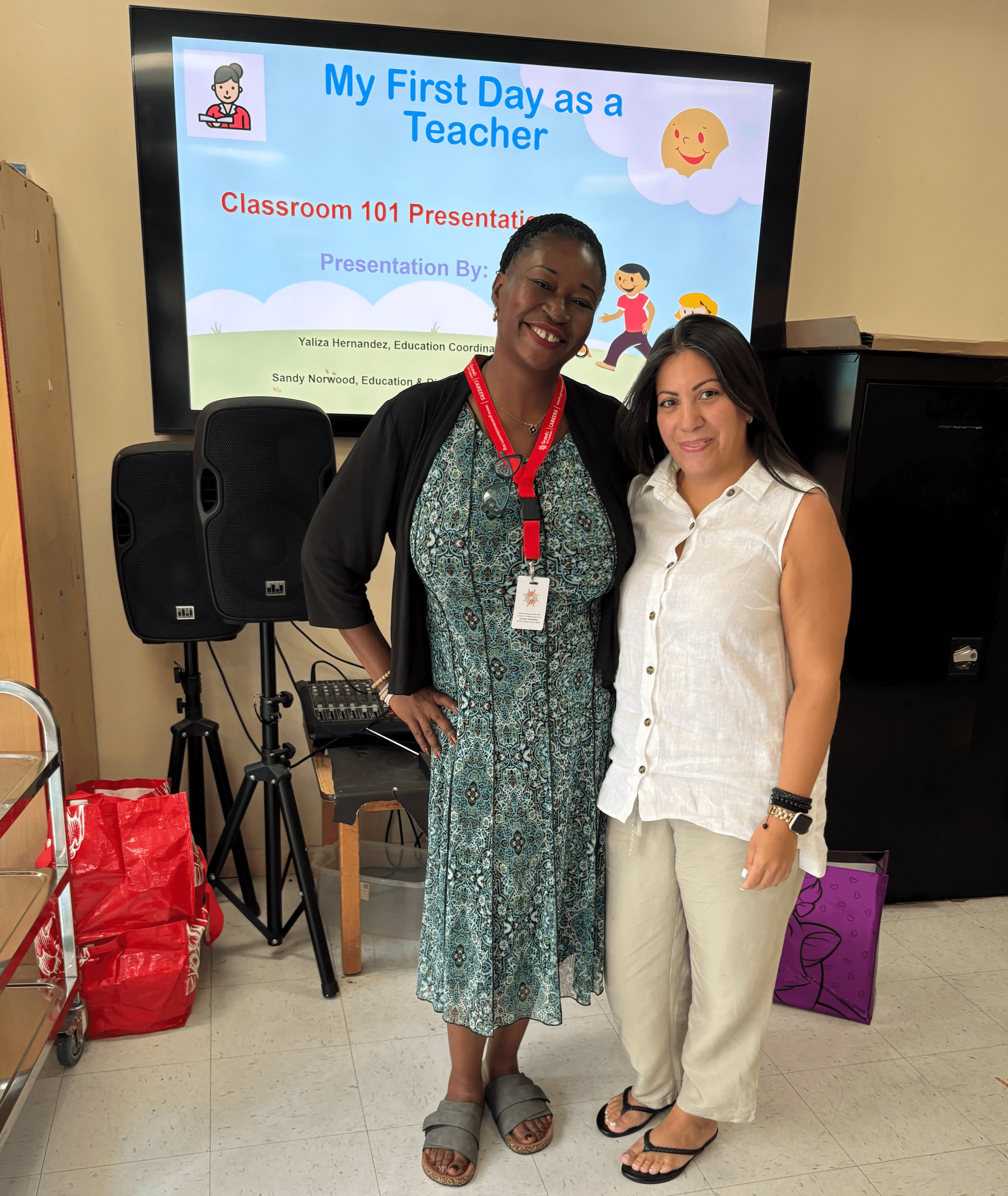 A Grand Street Site Director poses with the presentation facilitator of "My First Day as a Teacher".