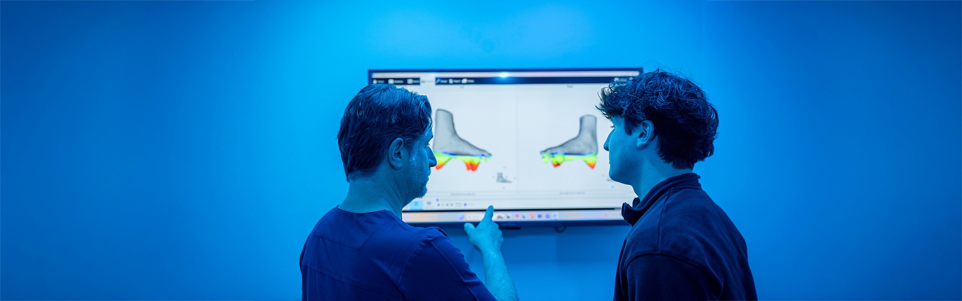 doctor-checking-monitor-with-patient