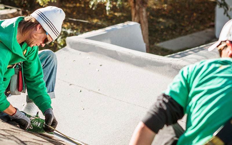 Two men looking at a laptop together