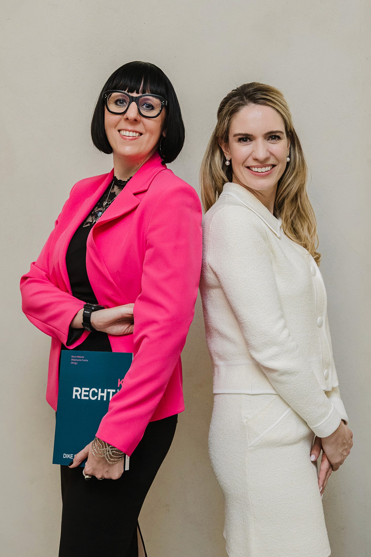 Authors posing with the Recht KI book at book launch in Zurich
