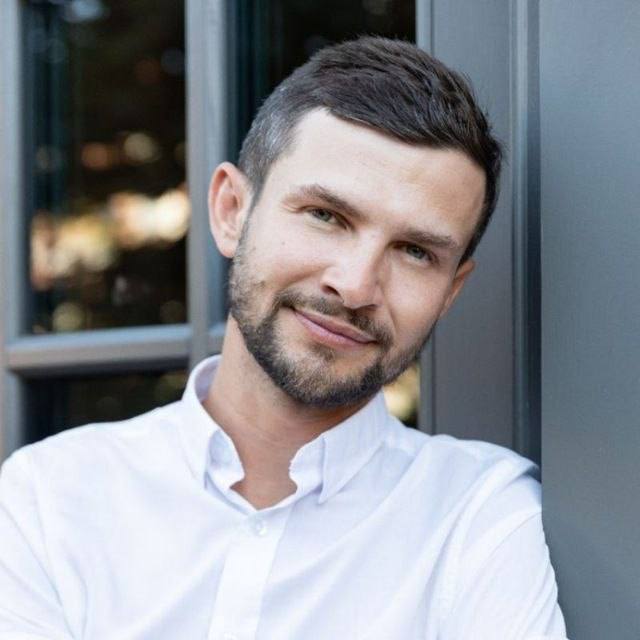 Woman in colorful striped sweater.