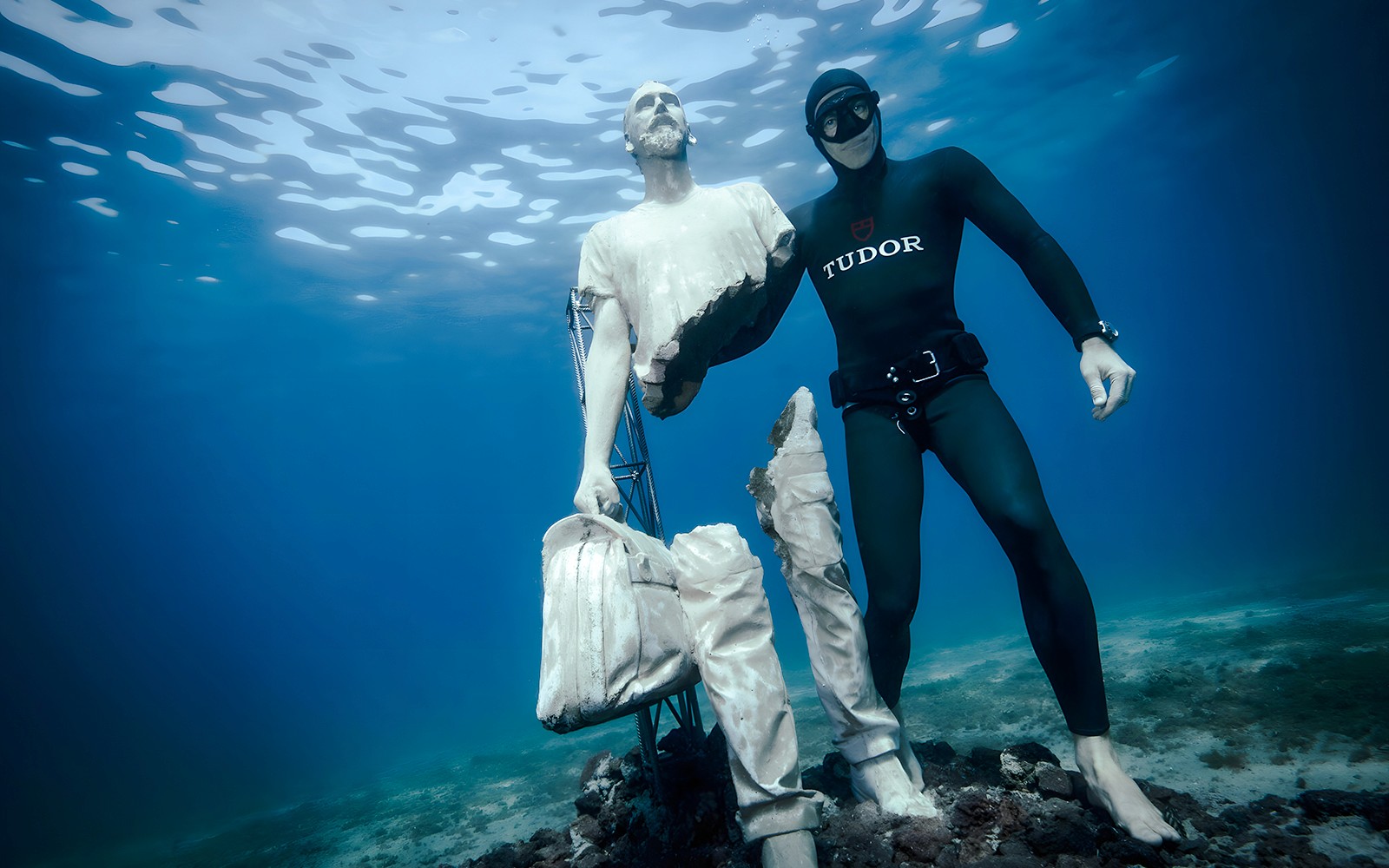 Diver with statue in Underwater Museum of Marseille.