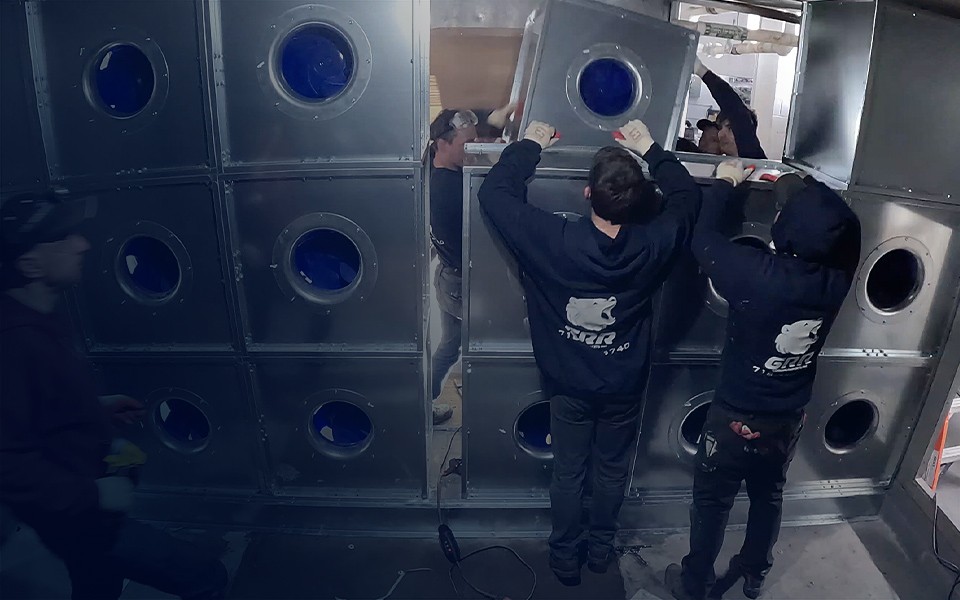 GRR Cooling Experts technicians installing and upgrading ventilation systems for hospital operating rooms and laboratory environments.