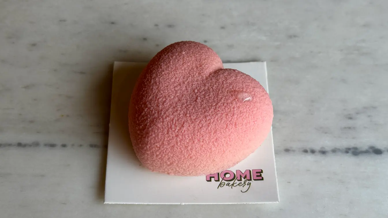 Pink heart-shaped mousse cake with velvet texture finish