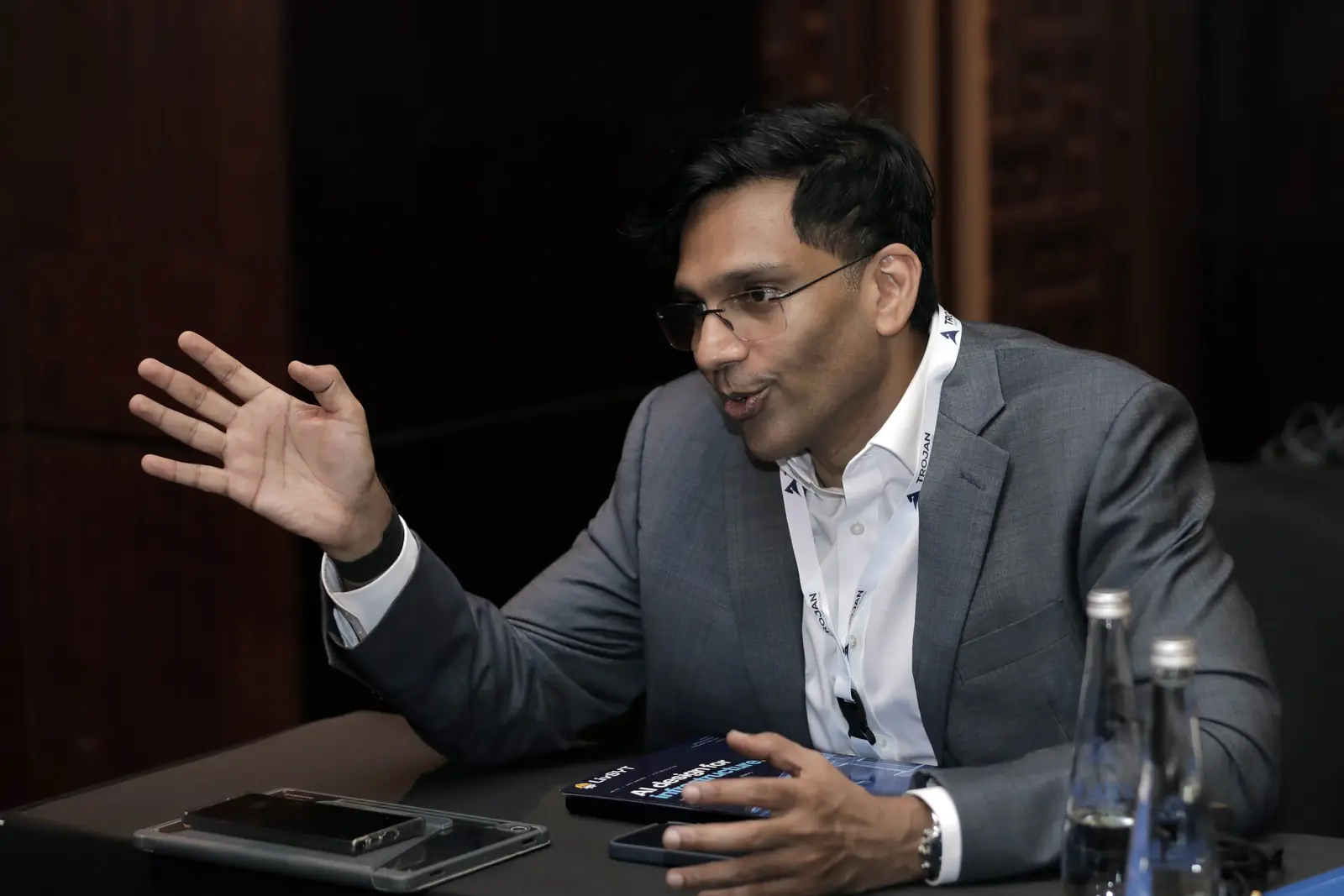 A LivSYT team member explains the product in a meeting