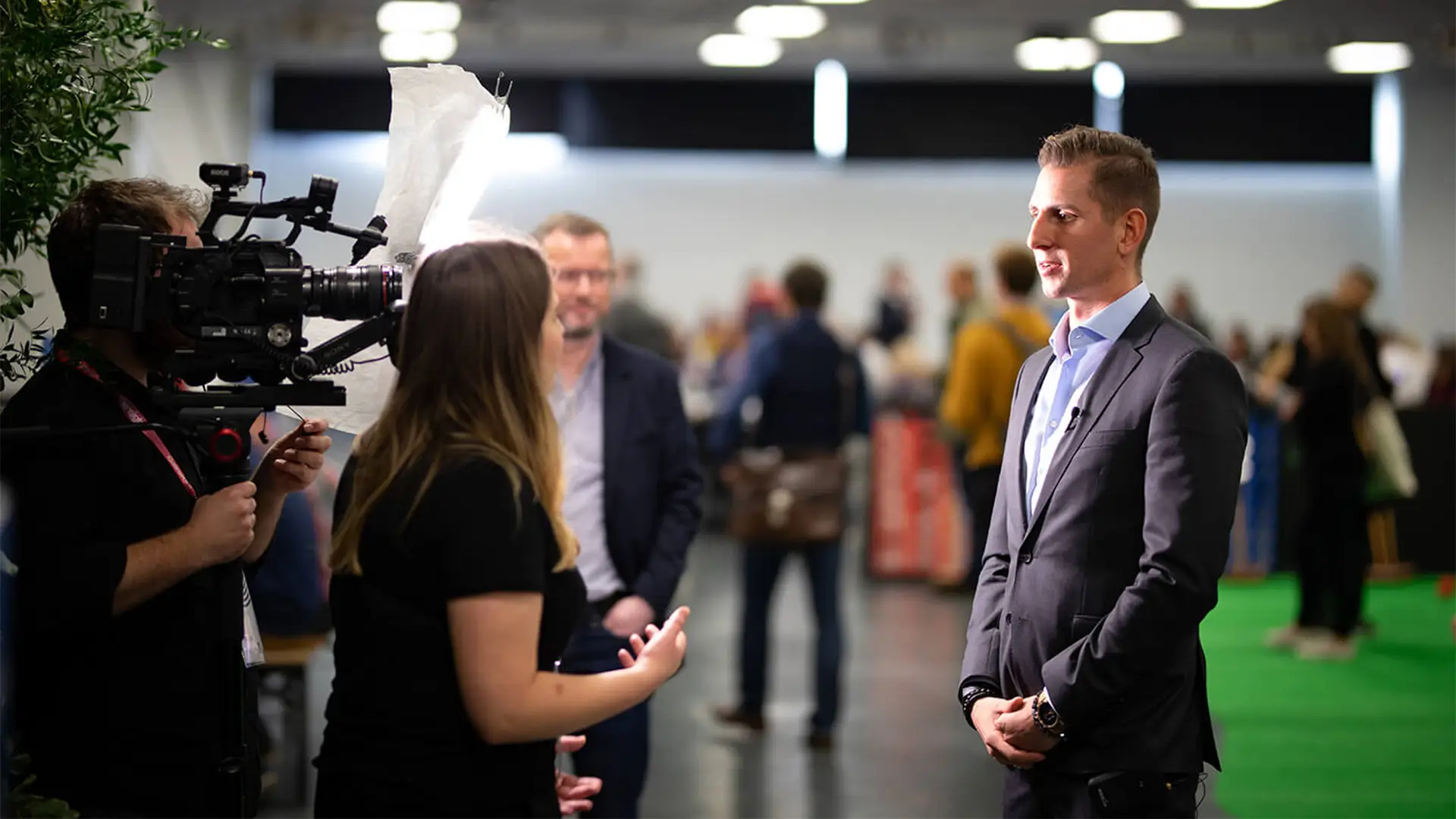 On-site video crew filming an interview with a conference speaker during Gainsight Pulse