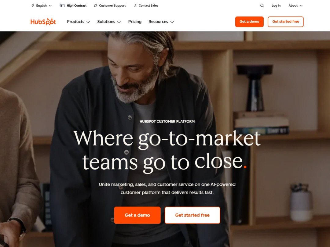 Hubspot website hero section with a wide picture of a man that covers the entire section 