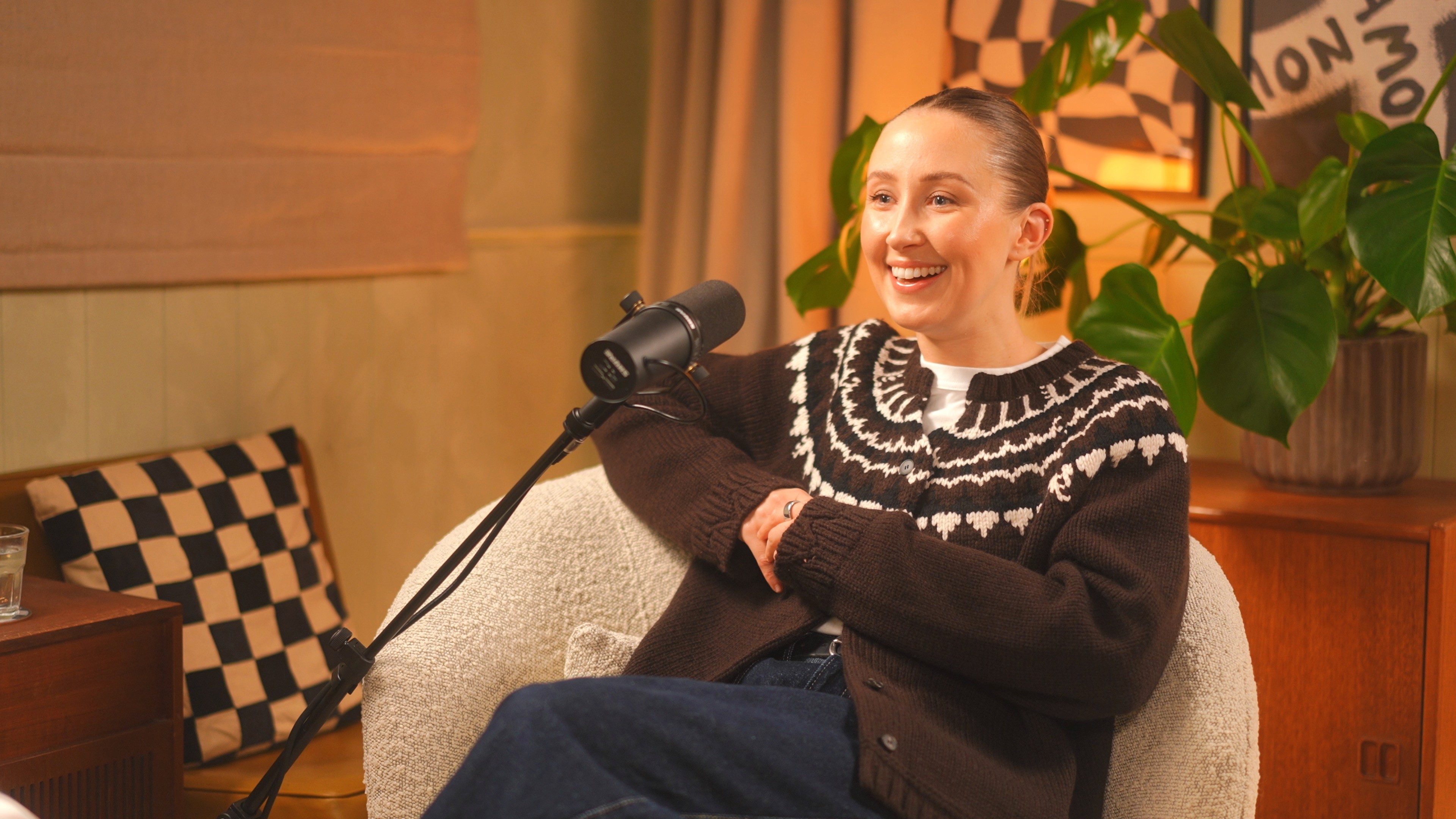 Contemporary interior with sculpted angled walls and a skylight filling the space with natural light.