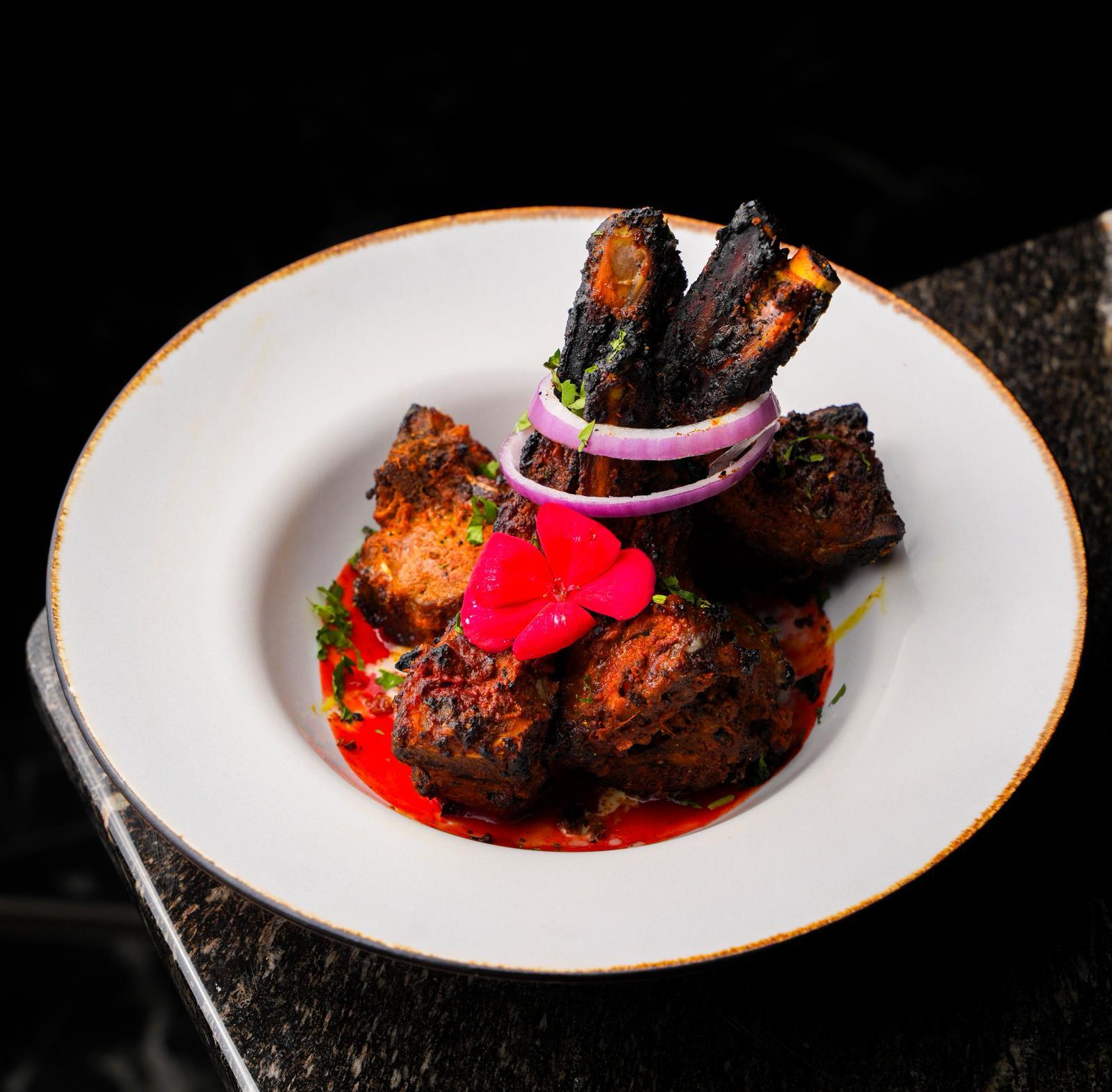 Tandoori lamb chops at Dhoom in Greektown Toronto, charcoal grilled lamb with Indian spices