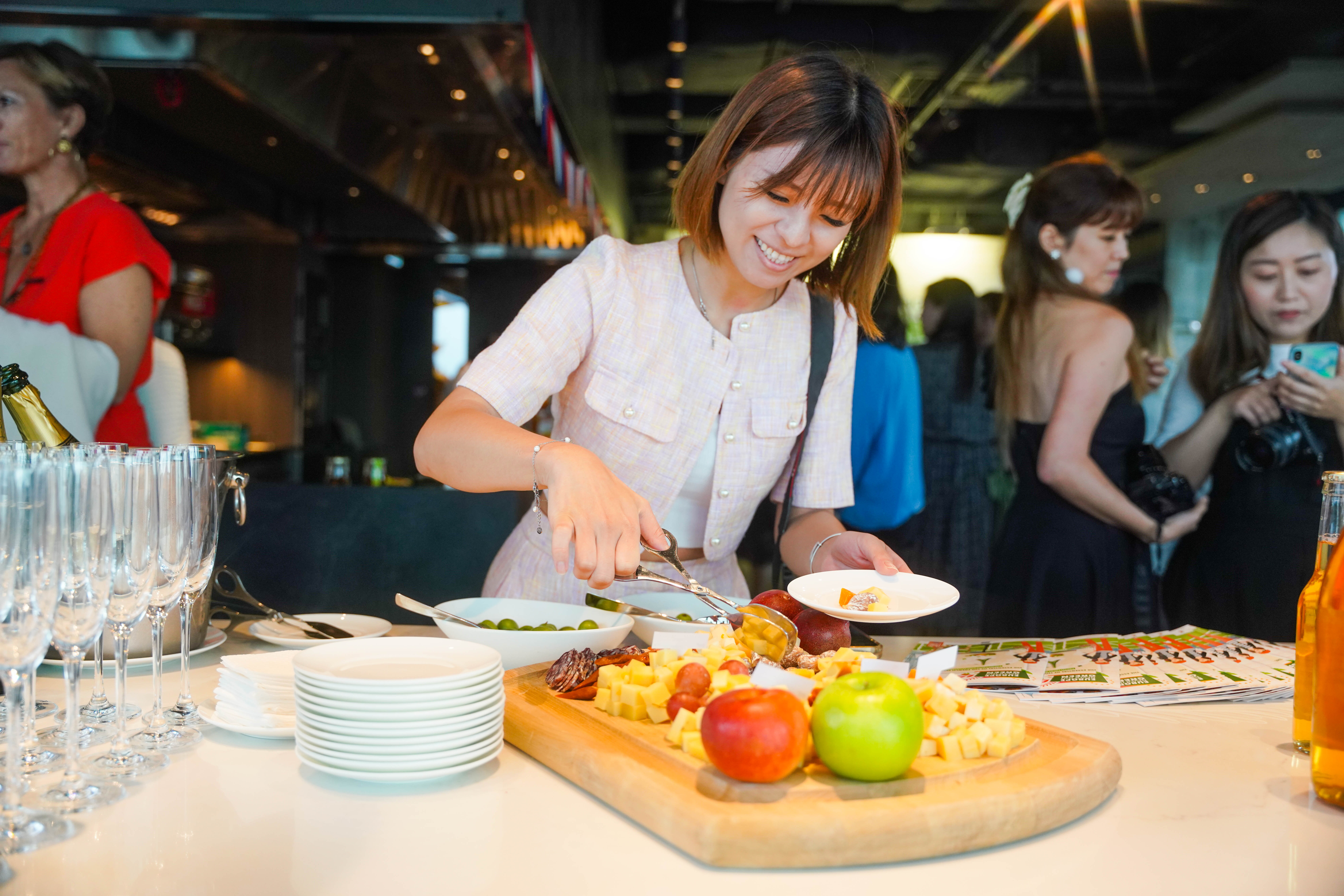man wearing gray polo shirt beside dry-erase board
