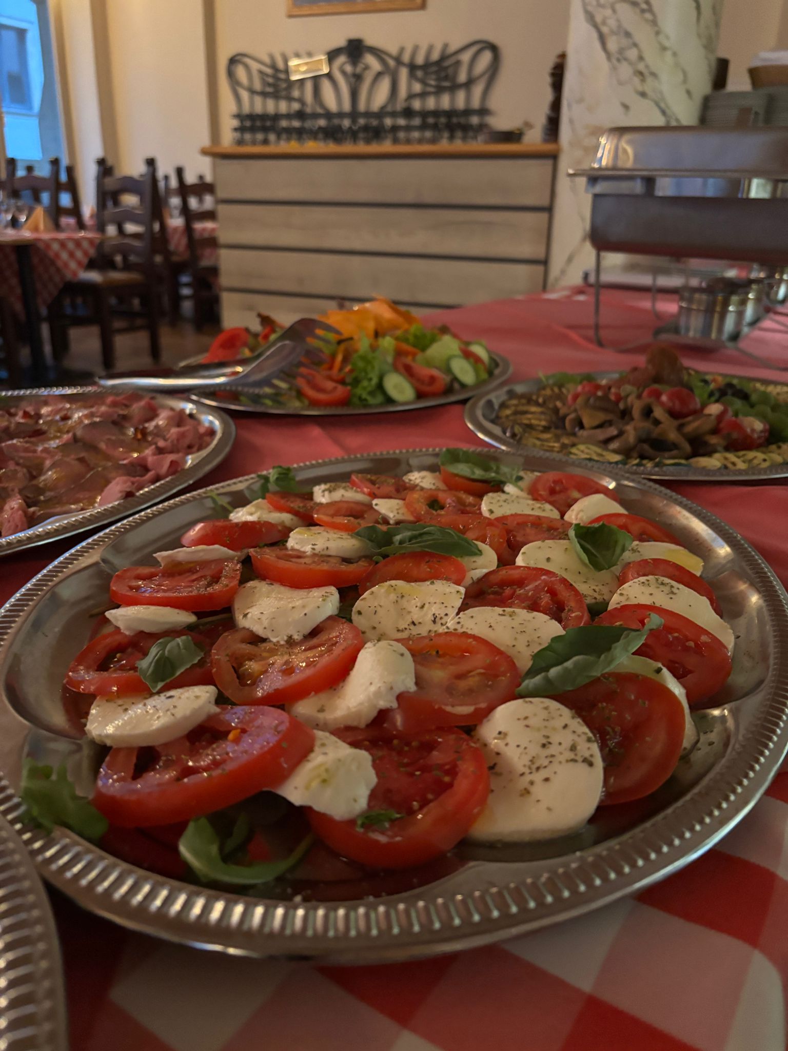 an interior of a fine dining restaurant with focused shot on the table with the plates and glass has been served