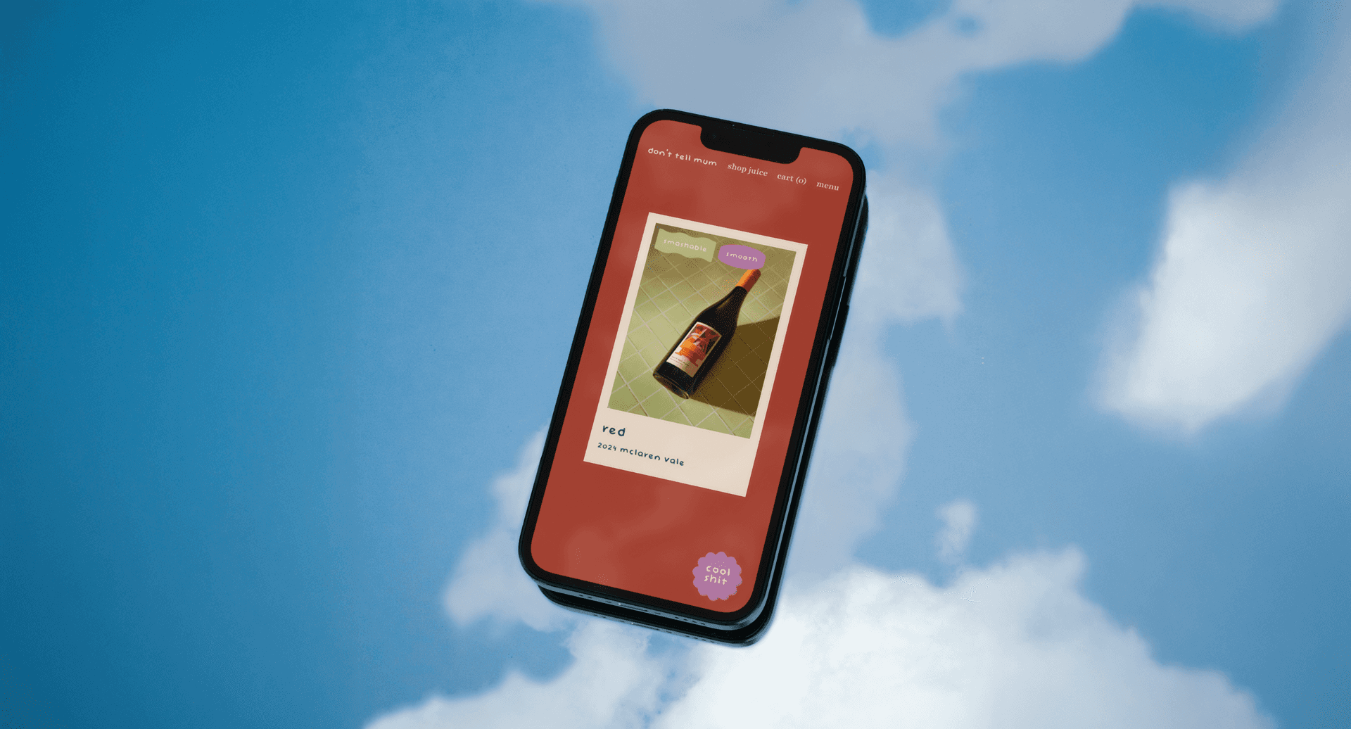 'Don't Tell Mum' website displayed on an iphone in the sky.