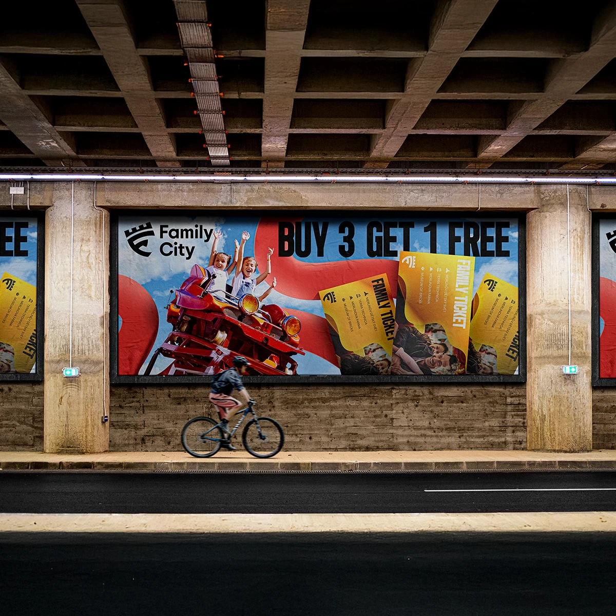Family City amusement park billboard advertisement with buy 3 get 1 free ticket offer displayed underground.