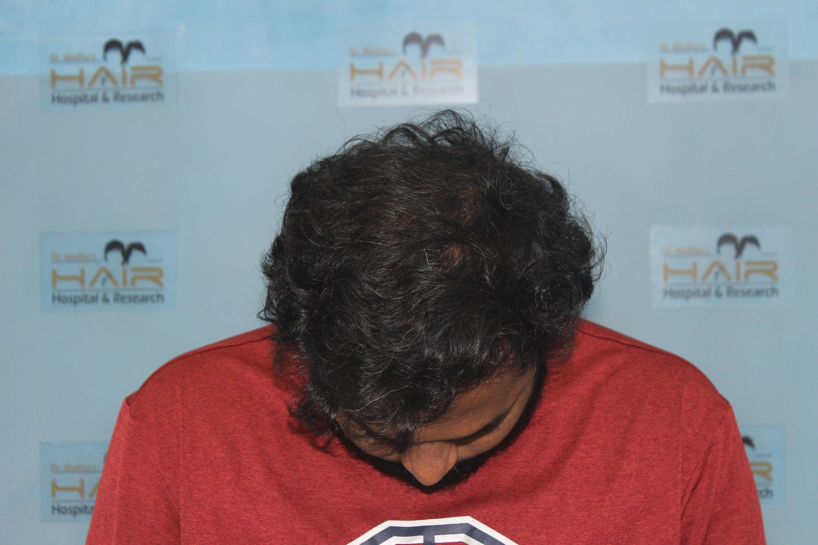 Child with headphones using tablet on train