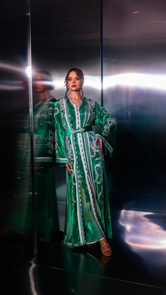 Emerald Moroccan caftan with silver hand embroidery, luxury handcrafted design prepared in Bahrain and finished by Moroccan artisans