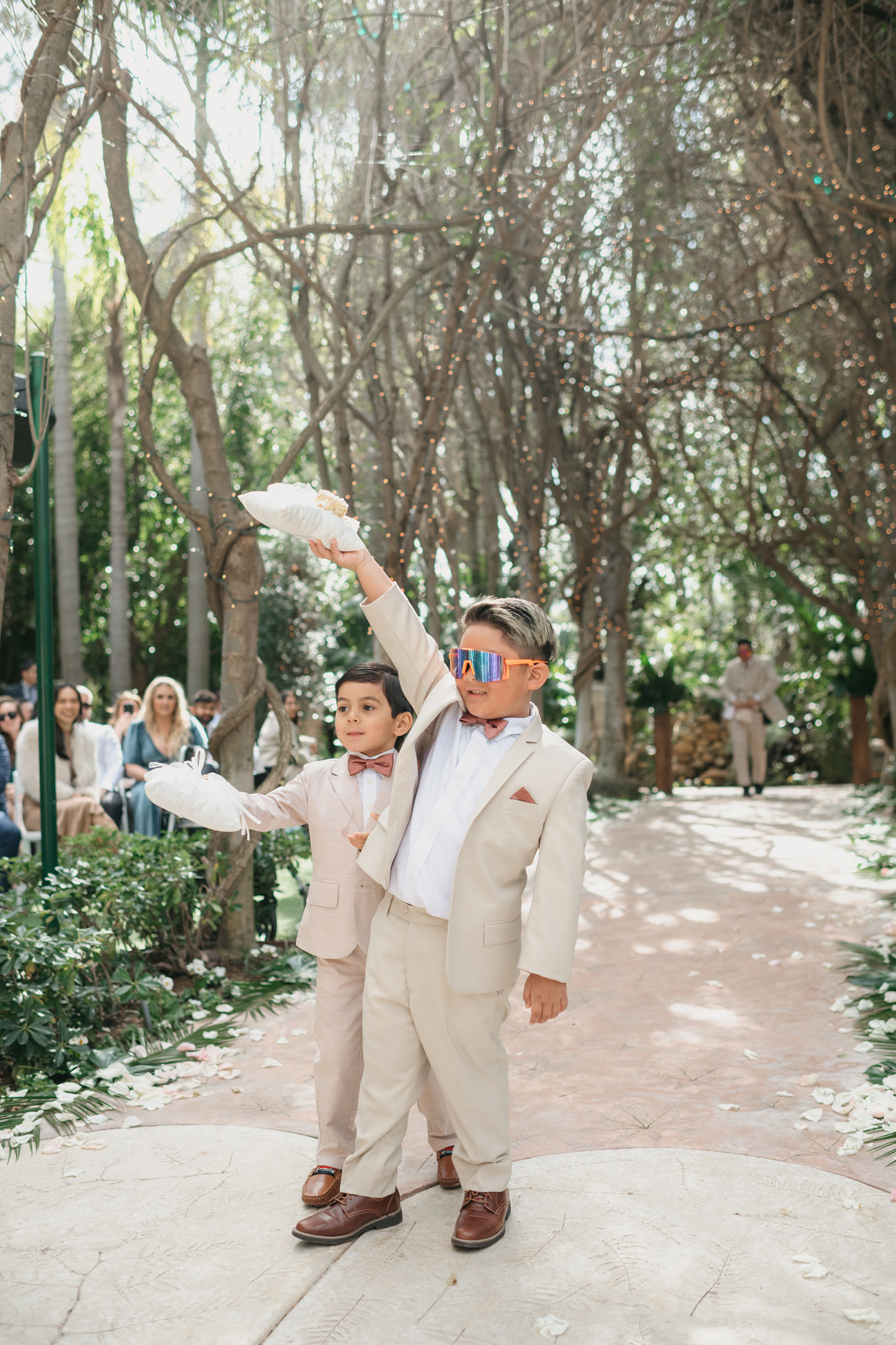 Flat lay wedding details with bouquet, rings, and sparkling bridal heels