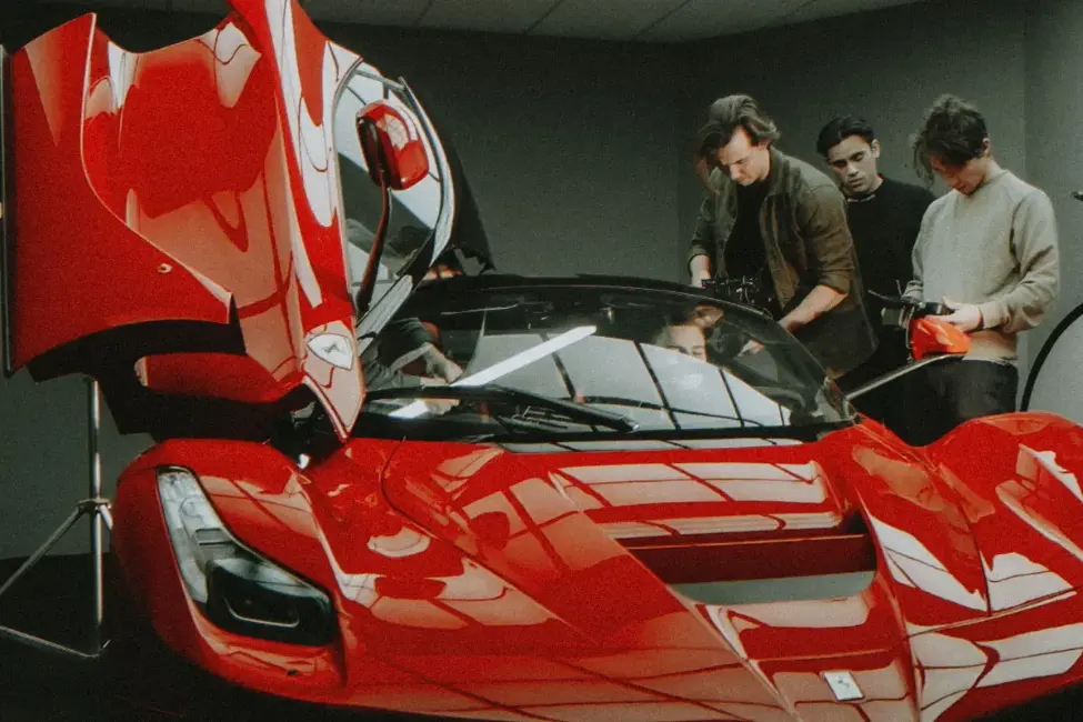 Reilin and their film crew working on filming a car