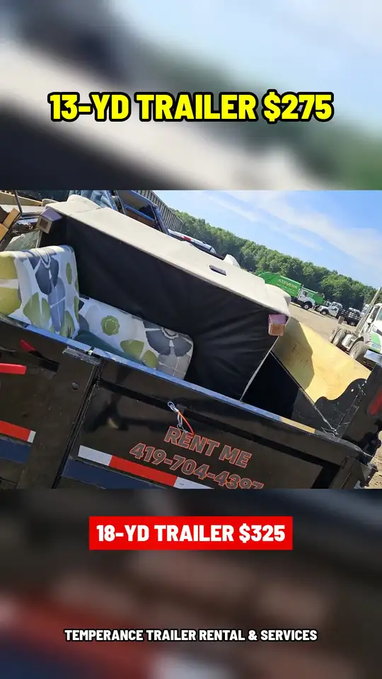 Dumpster trailer dumping a load