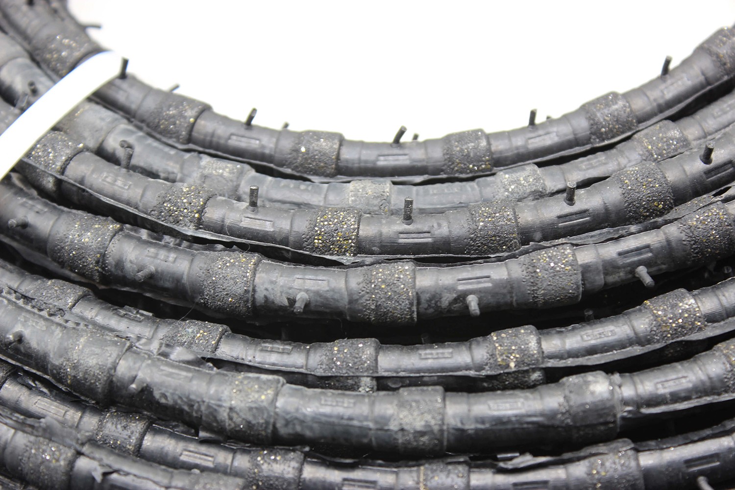 Close-up of the Diamond Wire Saw segments designed for cutting through reinforced concrete.