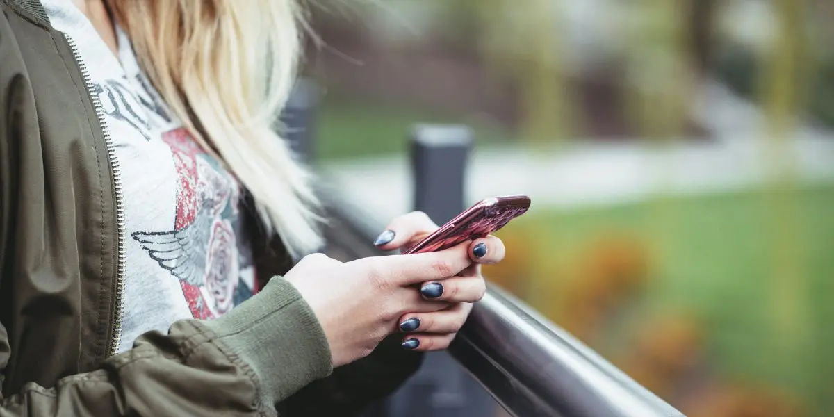 Close up of woman using her smartphone