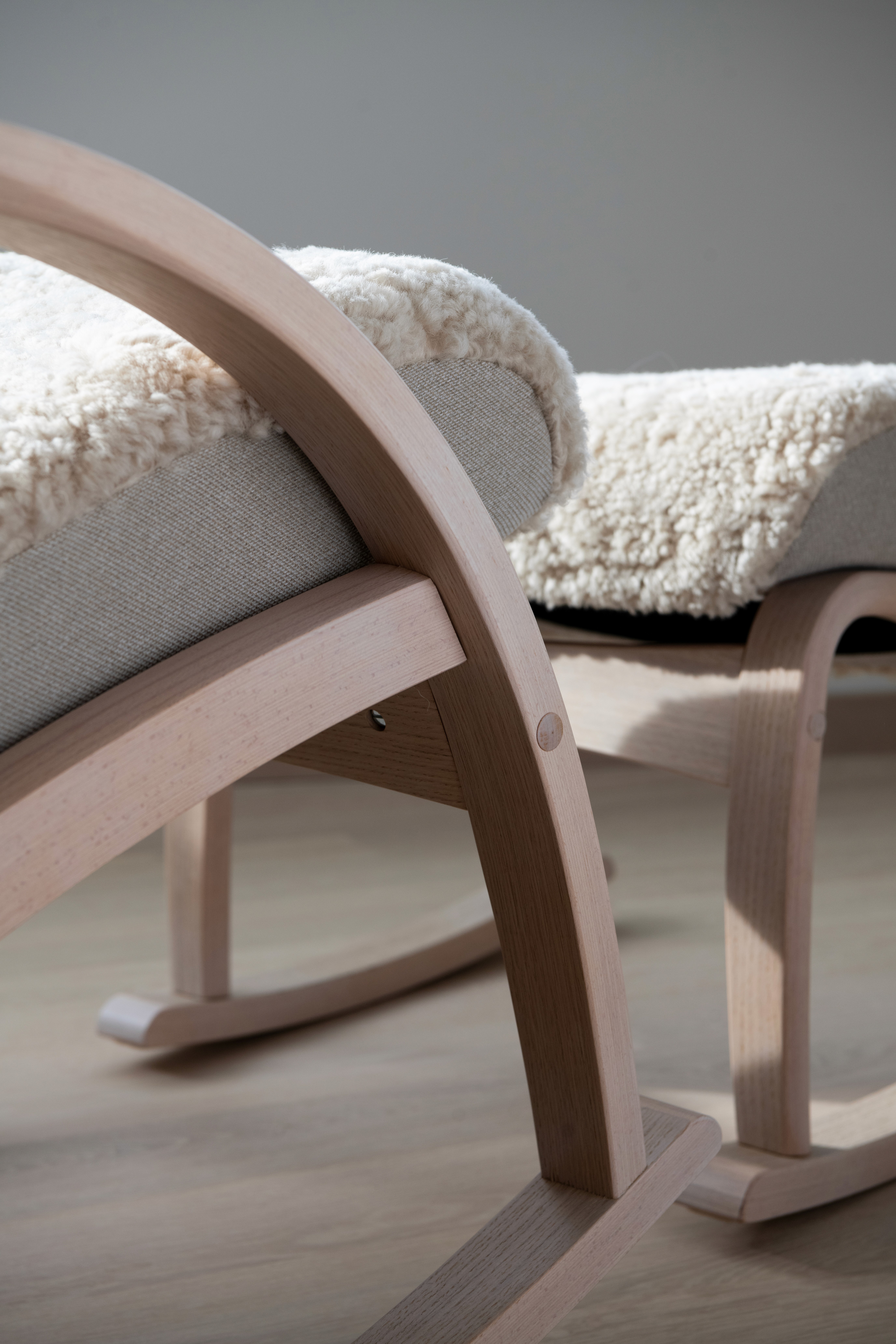 A scene of a wall with plants' shadow casted onto it