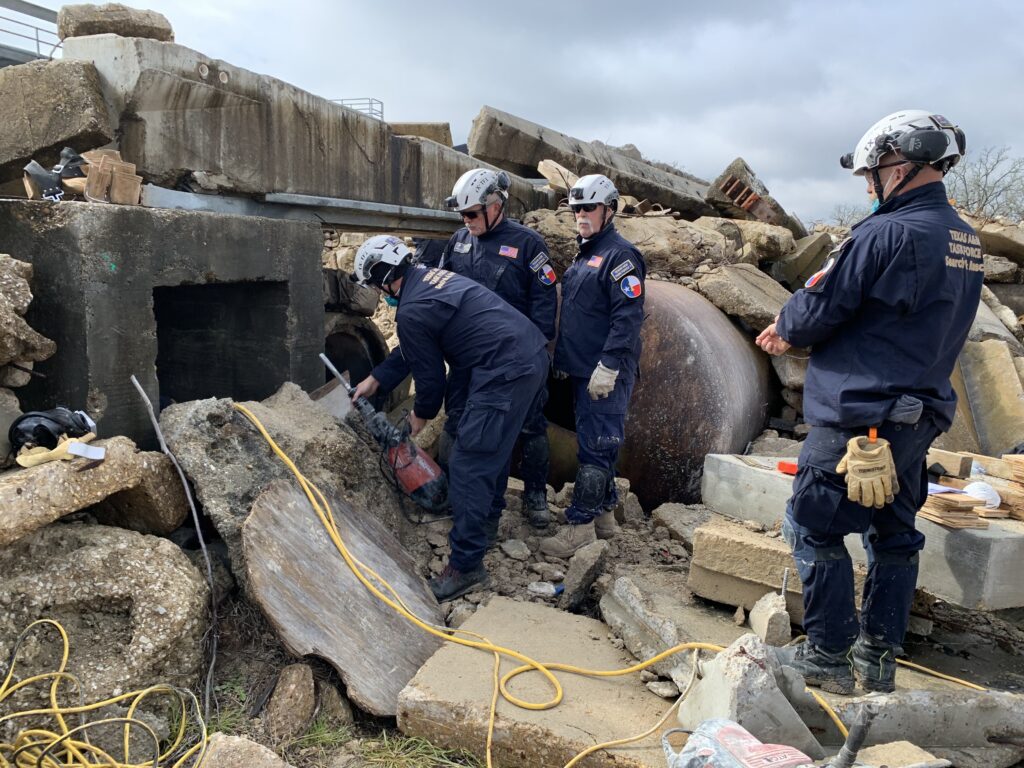 Members of TX-TF1 search a collapsed structure at TEEX’s Disaster City.