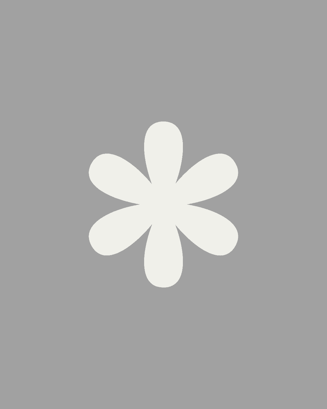 A person in a brown suit and cream scarf poses against a neutral background, showcasing elegant and classic fashion.