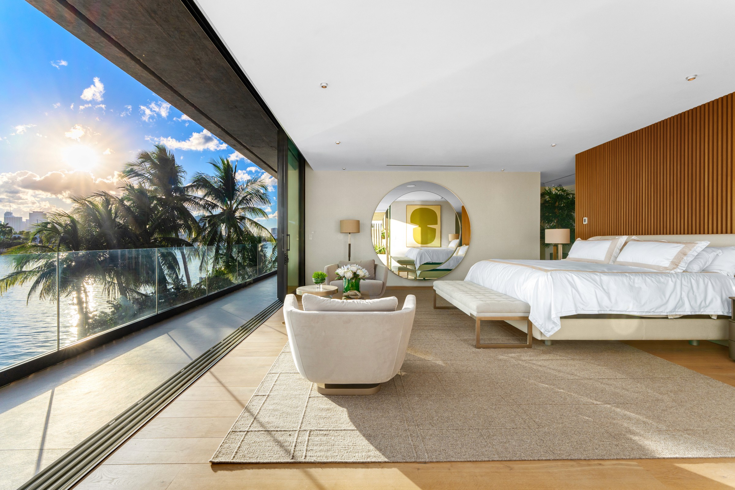 Modern bedroom featuring large windows with a view, minimalist decor, and natural light edited by Final Photo