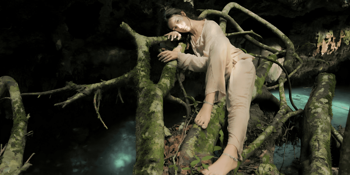 Women practicing yoga at a Nayade retreat, blending spiritual travel, community connection, mindful movement, and empowering wellness experiences in scenic destinations.