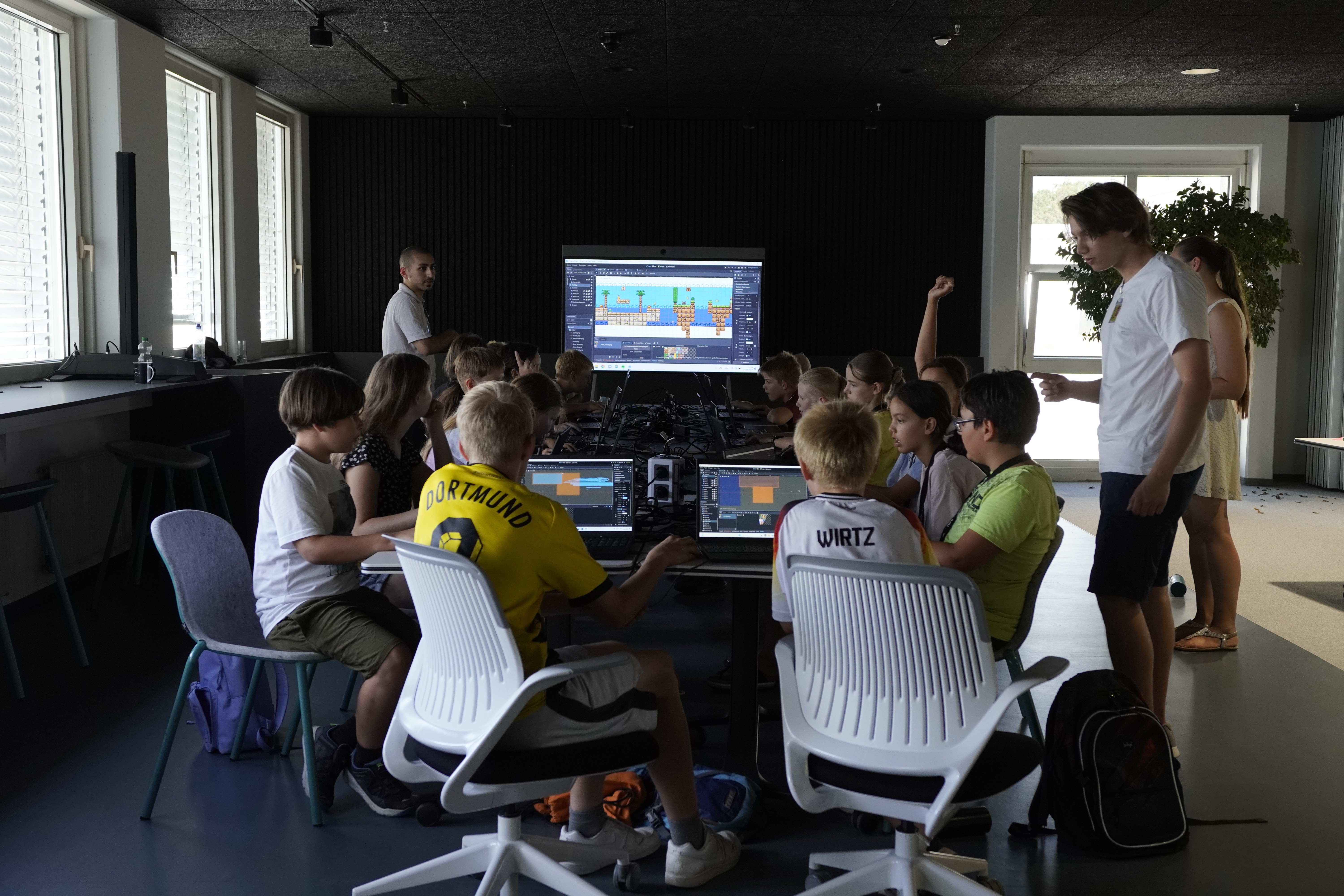 Yoshi and Jasper teaching a game development workshop for kids