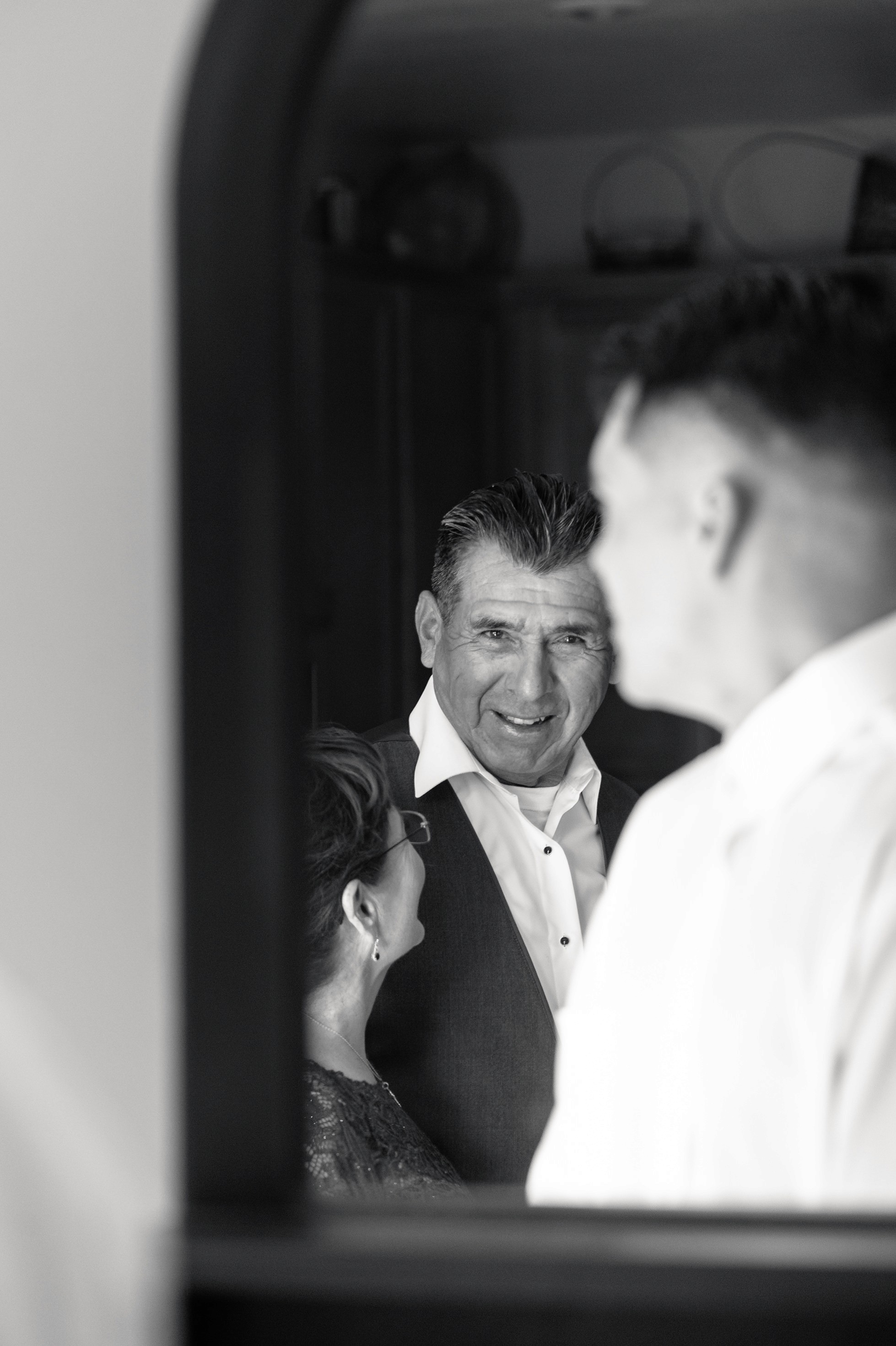 Flat lay wedding details with bouquet, rings, and sparkling bridal heels