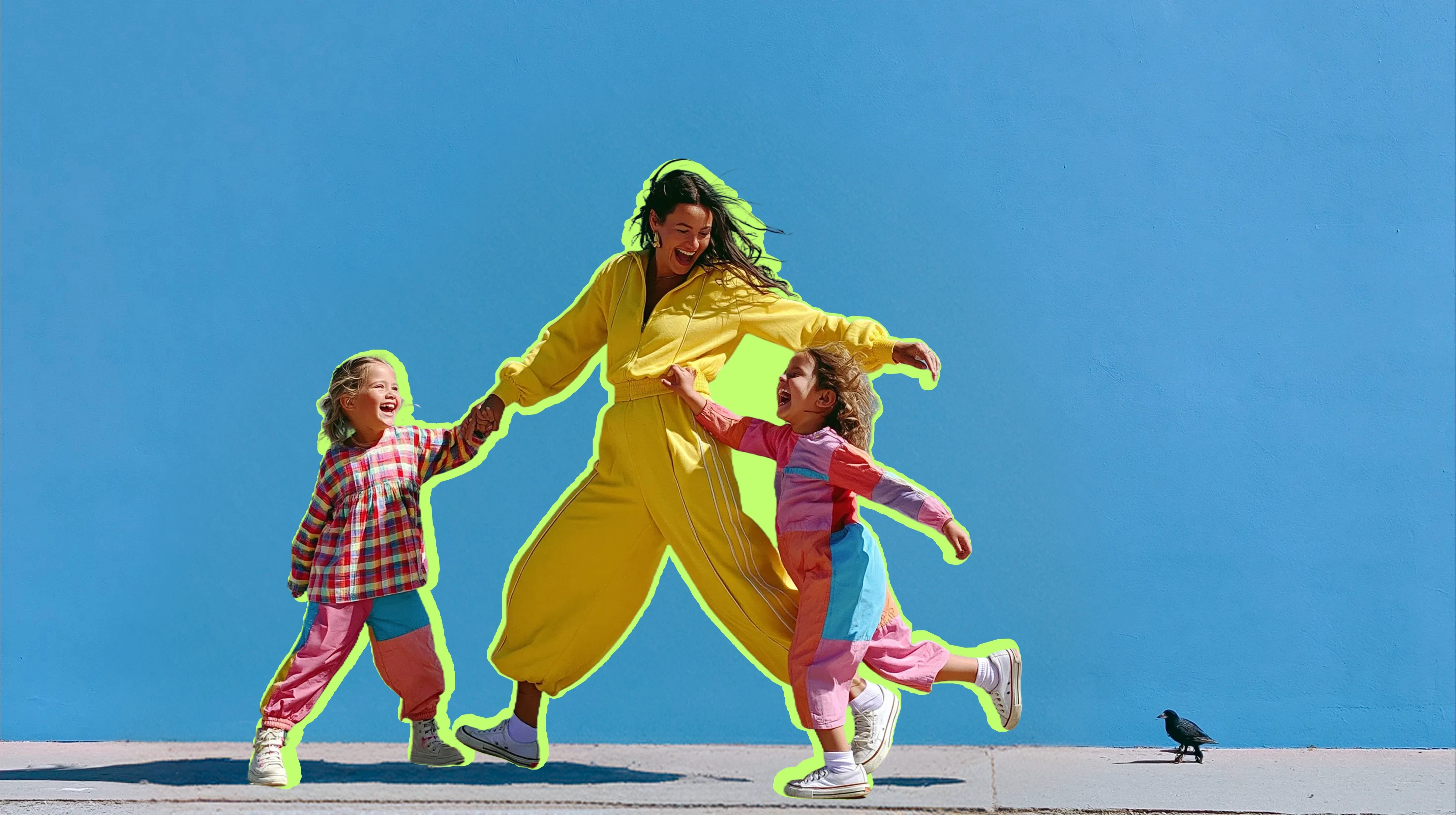 A mother laughing and holding hands with her two young daughters as they run together against a bright blue sky.