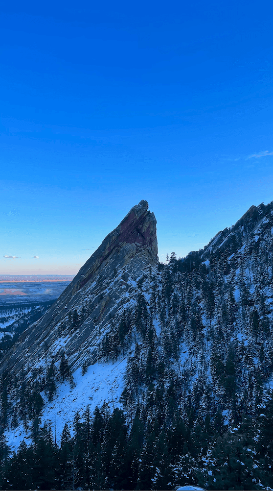 a group of people walking on a sidewalk
