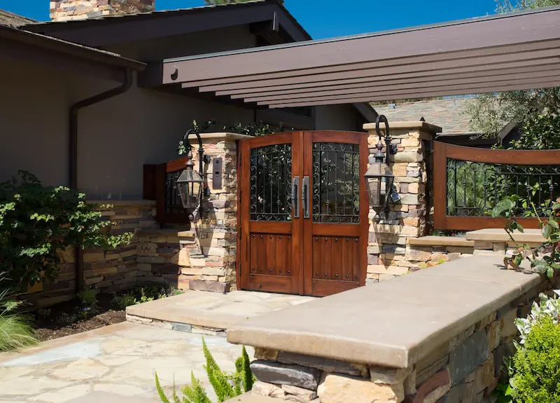 Beautiful wooden entry gate with wrought iron. From the Big Canyon Remodel project. Photo by Chris Darnall.