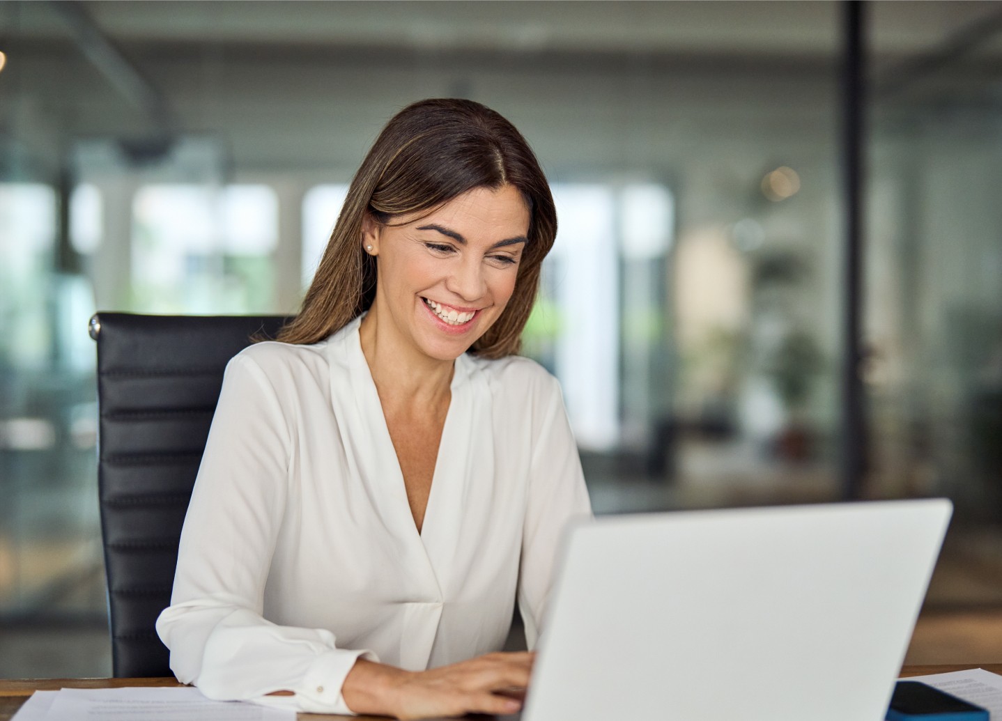 An image of an employee working and enjoying the Blink Employee Self Service Portal.